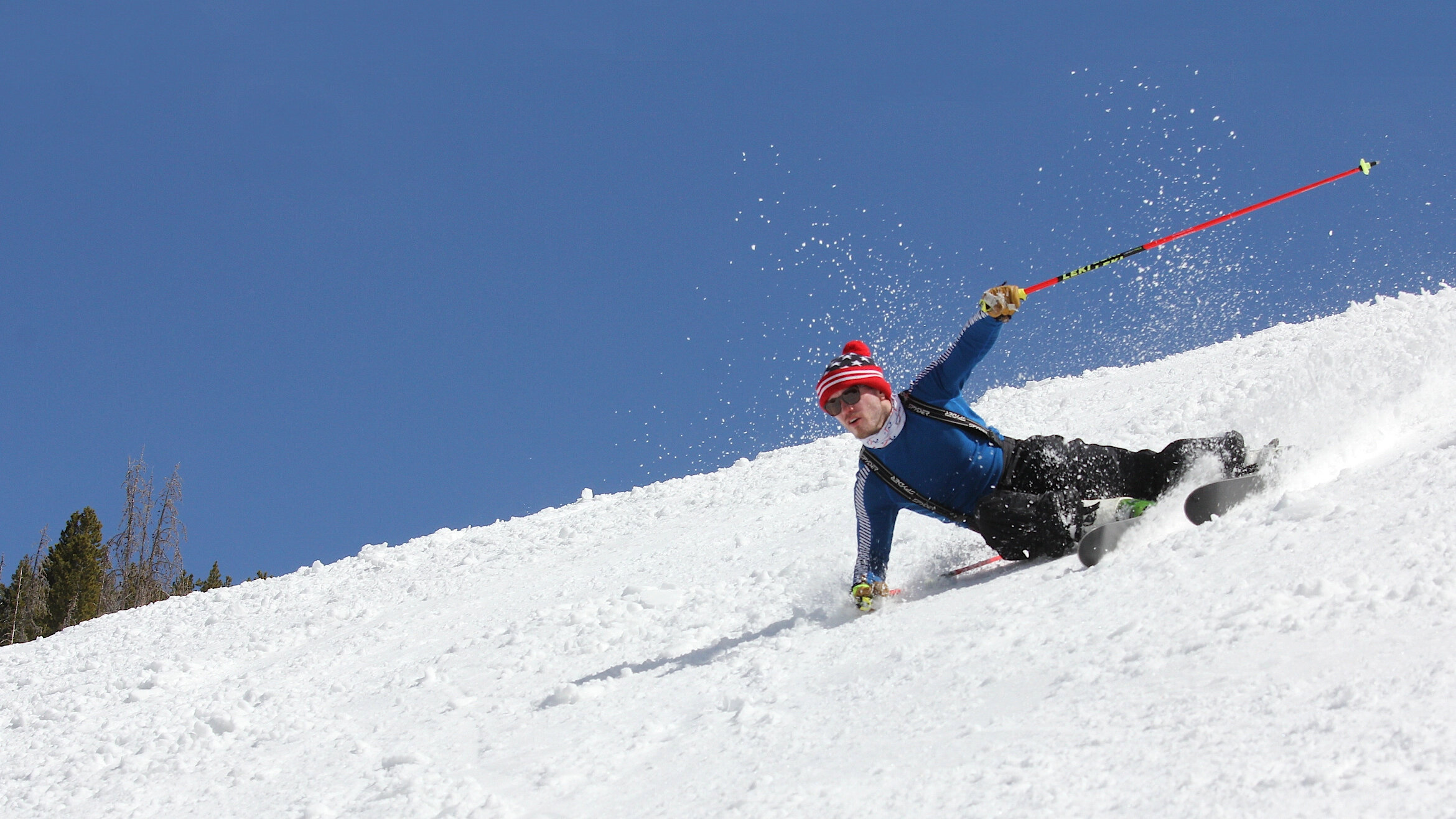 Skier carving on handcrafted wooden skis